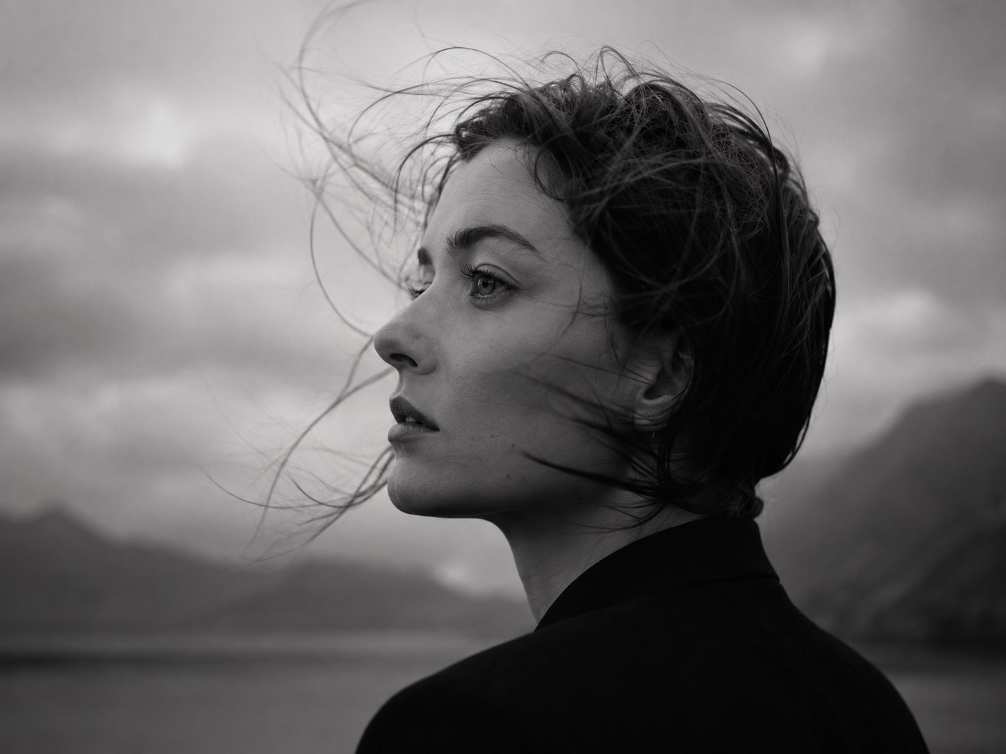 A black and white portrait in wind.